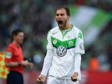 Wolfsburg's Dutch striker Bas Dost celebrates scoring during the German Cup DFB Pokal final football match between BVB Borussia Dortmund and VfL Wolfsburg at the Olympic Stadium in Berlin on May 30, 2015