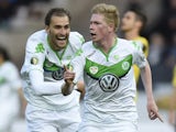 Wolfsburg's Belgian midfielder Kevin De Bruyne celebrates scoring with his team-mates during the German Cup DFB Pokal final football match between BVB Borussia Dortmund and VfL Wolfsburg at the Olympic Stadium in Berlin on May 30, 2015