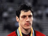 Alan Wells of Great Britain listens to the national anthem on the podium after winning the men's 100m final 25 July 1980