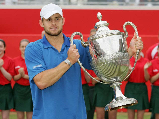 Andy Roddick of the U.S. holds up the trophy after winning the final match against Ivo Karlovic of Croatia at the Stella Artois Tennis Championships at the Queen's Club June 12, 2005