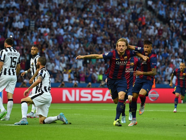 Ivan Rakitic of Barcelona celebrates scoring the opening goal with Neymar during the UEFA Champions League Final between Juventus and FC Barcelona at Olympiastadion on June 6, 2015