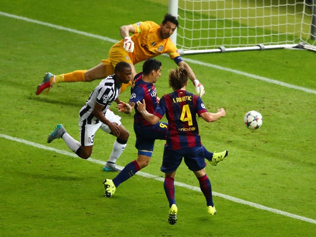 Luis Suarez of Barcelona scores his team's second goal during the UEFA Champions League Final between Juventus and FC Barcelona at Olympiastadion on June 6, 2015