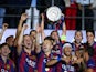 Xavi Hernandez of Barcelona lifts the trophy as he celebrates victory with team mates after the UEFA Champions League Final between Juventus and FC Barcelona at Olympiastadion on June 6, 2015