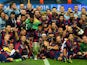 The Barcelona team celebrate victory with the trophy after the UEFA Champions League Final between Juventus and FC Barcelona at Olympiastadion on June 6, 2015