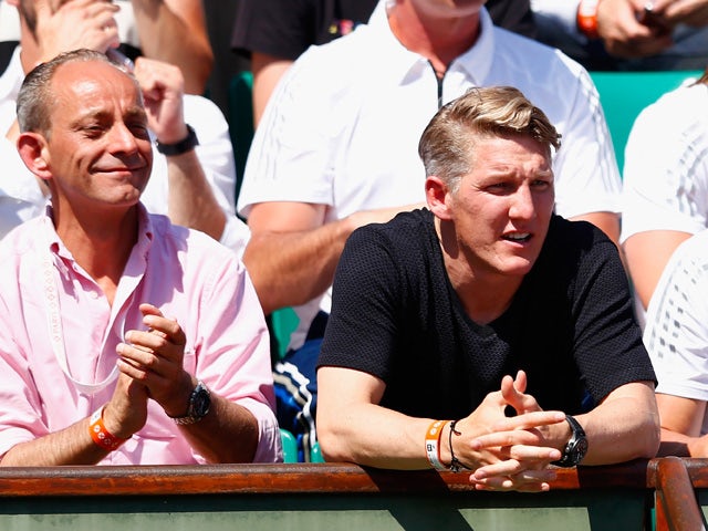 Bastian Schweinsteiger (R) watches Ana Ivanovic of Serbia in her Women's Semi final match against Lucie Safarova of Czech Repbulic on day twelve of the 2015 French Open at Roland Garros on June 4, 2015