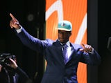 DeVante Parker of the Louisville Cardinals walks on stage after being picked #14 overall by the Miami Dolphins during the first round of the 2015 NFL Draft at the Auditorium Theatre of Roosevelt University on April 30, 2015