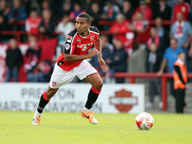 Joe Widdowson of Morecambe in action during the Sky Bet League Two match between Morecambe and Northampton Town at Globe Arena on September 27, 2014
