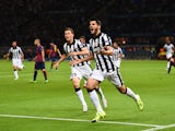 Alvaro Morata of Juventus celebrates scoring his team's first goal with Stephan Lichtsteiner during the UEFA Champions League Final between Juventus and FC Barcelona at Olympiastadion on June 6, 2015