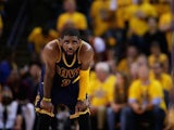 Cleveland Cavaliers point-guard Kyrie Irving looks on during game one of the NBA Finals on June 4, 2015