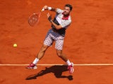Stanislas Wawrinka plays an overhead shot during the French Open semi-final against Jo-Wilfried Tsonga at Roland Garros on June 5, 2015