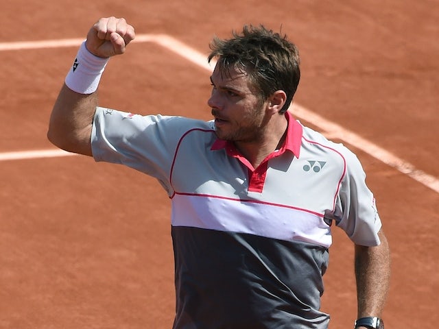 Switzerland's Stanislas Wawrinka reacts after winning the second set against Serbia's Novak Djokovic during their men's final match of the Roland Garros 2015 French Tennis Open in Paris on June 7, 2015