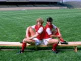 Tony Woodcockand Charlie Nicholas of Arsenal sit on a bench at Highbury in London in July 1983