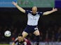Ben Kennedy of Stevenage is challenged by Adam Barrett of Southend United during the Sky Bet League Two Playoff semi final match between Southend United and Stevenage at Roots Hall on May 14, 2015