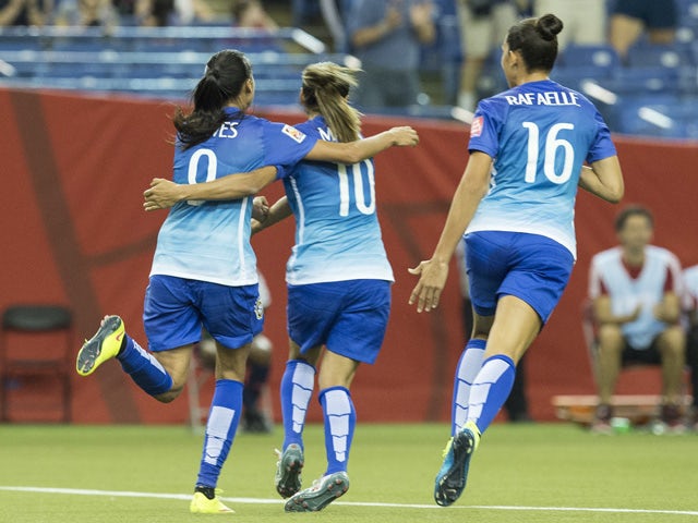Brazil's Andressa Alves (L), Marta (C) and Rafaelle celebrate after Alves scored against Spain during a Group E match at the 2015 FIFA Women's World Cup at the Olympic Stadium in Montreal on June 13, 2015