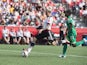 Germany's Anja Mittag shoots to score despite Ivory Coast's Sophie Aguie (R) during a Group B match at the 2015 FIFA Women's World Cup at Landsdowne Stadium in Ottawa on June 7, 2015