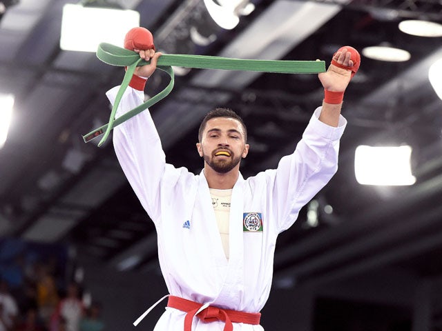 Azerbaijan's Aykhan Mamayev reacts after winning the gold medal after competing against Greece's Michail Georgios Tzanos (unseen) in the Men's Karate Kumite -84kg, as part of the 2015 European Games in Baku on June 14, 2015