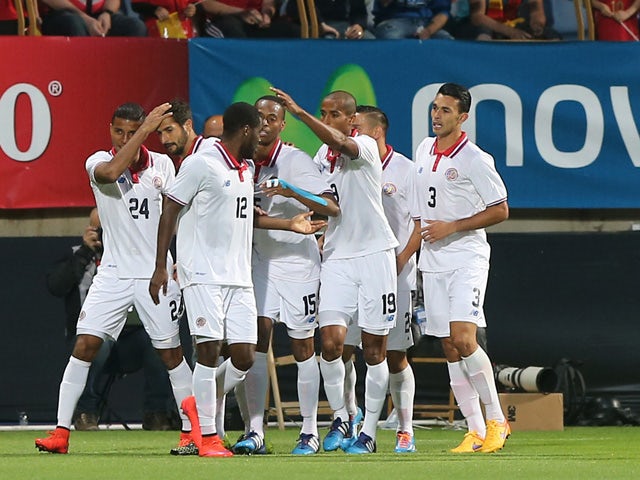 Costa Rica's players celebrate a goal during the friendly football match Spain vs Costa Rica at the Reino de Leon stadium in Leon on June 11, 2015