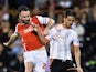 Bryan Ruiz of Fulham battles with Craig Morgan of Rotherham United during the Sky Bet Championship match between Fulham and Rotherham United at Craven Cottage on April 15, 2015