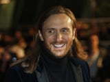 French DJ David Guetta poses upon his arrival at the Palais des Festivals to attend the 16th Annual NRJ Music Awards on December 13, 2014