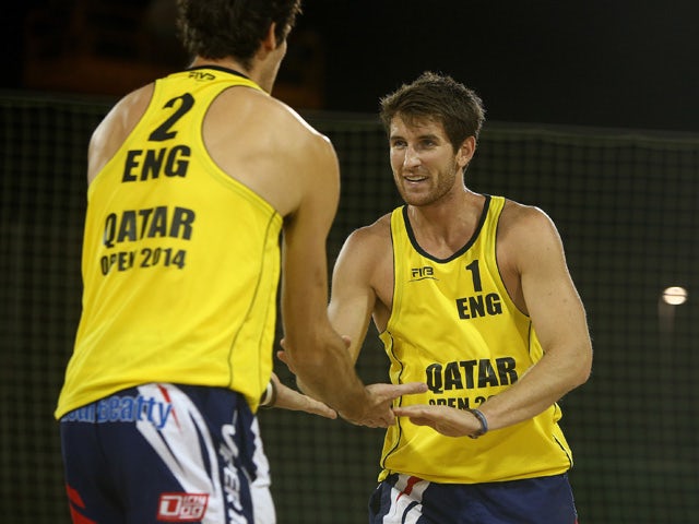 Jake Sheaf of England celebrates with team mate Chris Gregory during day two of the FIVB Qatar Open at The Al Gharafa Sports Club on November 05, 2014