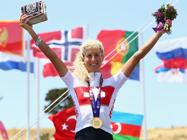Jolanda Neff of Switzerland celebrates with her gold medal after winning the Womens' Cross-country Mountain Bike Cycling during day one of the Baku 2015 European Games at Mountain Bike Velopark on June 13, 2015