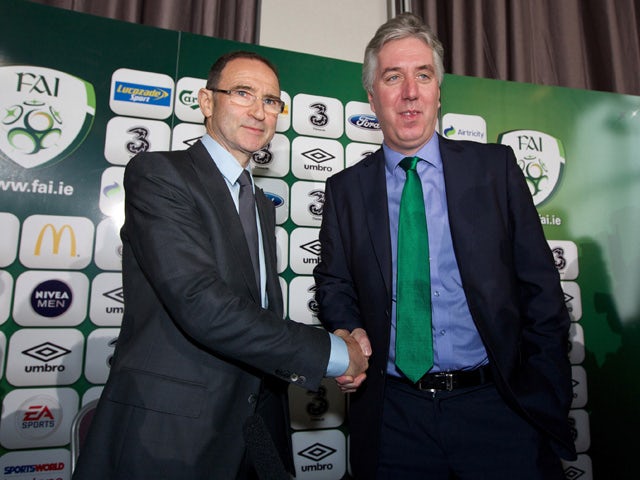 Newly appointed Republic of Ireland manager Martin O'Neill shakes hands with John Delaney, Chief Executive of the FAI during a press conference at Gibson Hotel on November 09, 2013