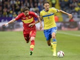 Midfielder Mladen Kascelan (L) of Montenegro vies with midfielder Albin Ekdal of Sweden during the Euro qualifying football match between Sweden and Montenegro at the Friends Arena in Solna near Stockholm on June 14, 2015