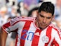 Paraguayan midfielder Nestor Ortigoza (L) is marked by Uruguayan midfielder Diego Perez during the 2011 Copa America football tournament final held at the Monumental stadium in Buenos Aires, on July 24, 2011