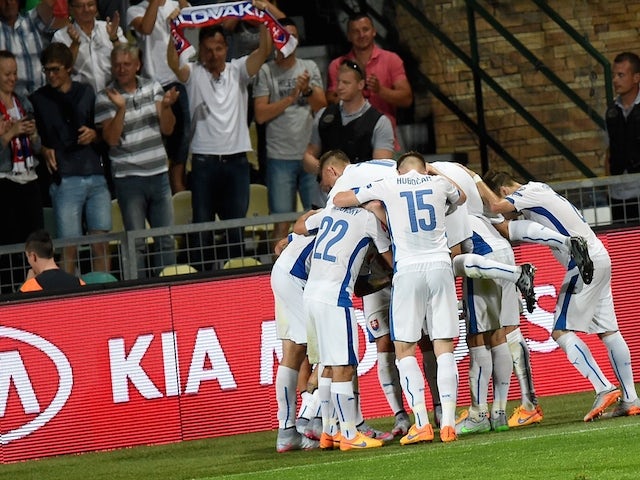 Slovakia's players celebrate the 2-0 goal during the Euro 2016 Group C qualifying football match Slovakia vs FYR Macedonia in Zilina, Slovakia on June 14, 2015