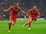 Wales player Gareth Bale celebrates after scoring the opening goal during the UEFA EURO Group B 2016 Qualifier between Wales and Belguim at Cardiff City stadium on June 12, 2015