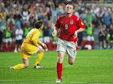 Wayne Rooney of England celebrates after scoring their third goal during the UEFA Euro 2004, Group B match between Croatia and England at the Luz Stadium on June 21, 2004