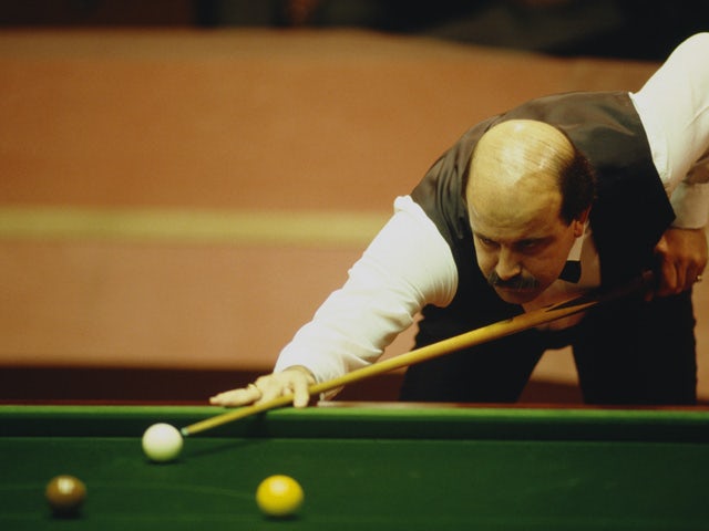 English snooker player Willie Thorne competing in the World Snooker Championship at the Crucible Theatre, Sheffield, 1988