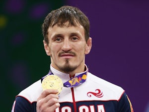 Gold medalist Aleksandr Bogomoev of Russia stands on the podium during the medal ceremony for the Men's Wrestling 61kg freestyle on day six of the Baku 2015 European Games at the Heydar Aliyev Arena on June 18, 2015