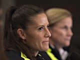 USA defender Ali Krieger (L) listens to questions with coach Jill Ellis during a news conference at the 2015 FIFA Women's World Cup in Vancouver on June 15, 2015