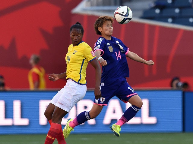 Japan's midfielder Asuna Tanaka (R) and Ecuador's forward Carina Caicedo vie for the ball during their Group C football match of the 2015 FIFA Women's World Cup in Winnipeg, Manitoba on June 16, 2015