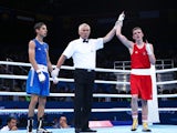 Brendan Irvine (red) of Ireland is declared the winner over Tinko Banabakov (blue) of Bulgaria in the Men's Boxing Light Fly weight 46-49kg round of 16 bout during day seven of the Baku 2015 European Games at the Crystal Hall on June 19, 2015