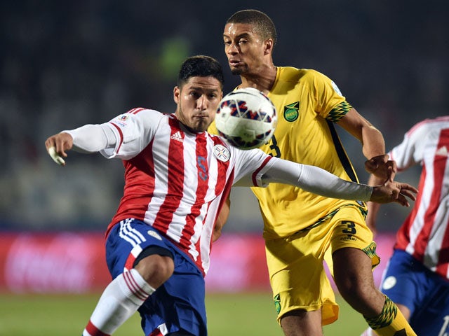 Paraguay's defender Bruno Valdez (L) and Jamaica's defender Michael Hector vie during their 2015 Copa America football championship match, in Antofagasta, Chile, on June 16, 2015