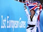 Charlie Maddock celebrates with the Union Jack after winning taekwondo gold for Team GB at the European Games on June 16, 2015
