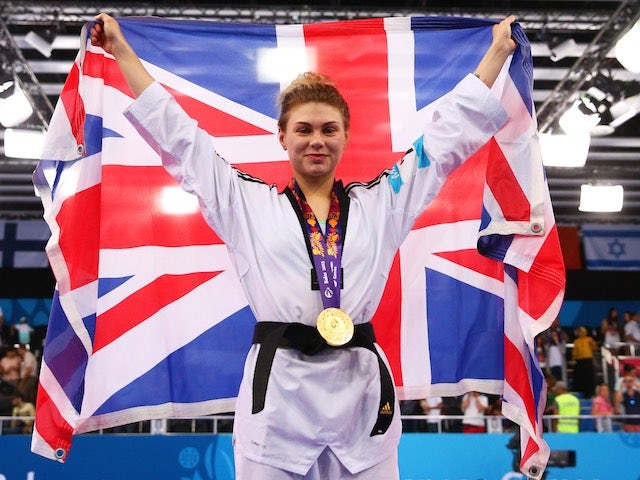 Team GB's taekwondo athlete Charlie Maddock poses with her gold medal earned at the European Games on June 16, 2015