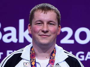 Gold medalist Christian Reitz of Germany poses with the medal won during the Men's Shooting 25m Rapid Fire Pistol on day nine of the Baku 2015 European Games at the Baku Shooting Centre on June 21, 2015