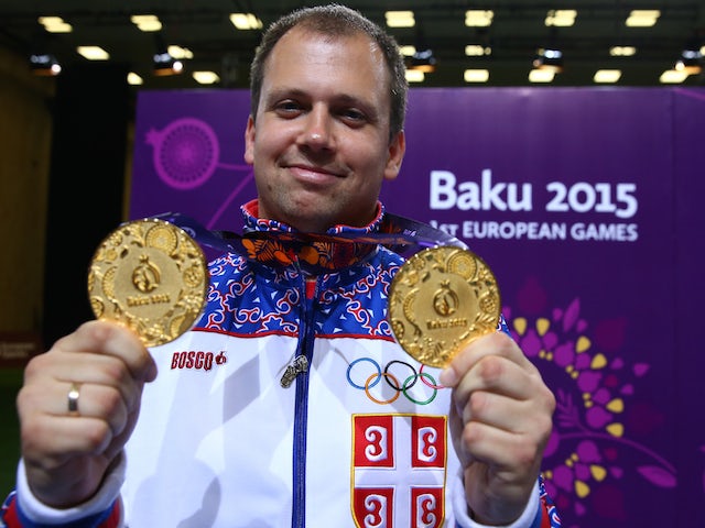 Gold medalist Damir Mikec of Serbia poses with the medals won during the Men's Pistol Shooting 50m final and 10 m final on day eight of the Baku 2015 European Games at the Baku Shooting Centre on June 20, 2015 