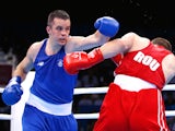 Darren O'Neill (blue)of Ireland and Ionut Jitaru (red) of Romania compete in the Men's Boxing Heavyweight 91kg during day four of the Baku 2015 European Games at Crystal Hall on June 16, 2015