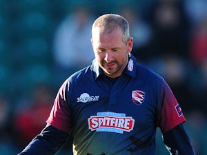 Darren Stevens of Kent Spitfires (R) celebrates with Adam Riley of Kent Spitfires after taking the wicket of Kumar Sangakkara of Surrey during the NatWest T20 Blast match between Kent and Surrey at The County Ground on May 29, 2015