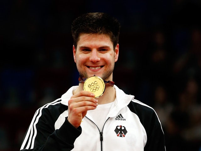 Gold medalist Dimitrij Ovtcharov of Germany stands on the podium after the Men's Table Tennis Finals during day seven of the Baku 2015 European Games at the Baku Sports Hall on June 19, 2015