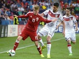 Germany's Emre Can (R) vies for a ball with Denmark's Nicolaj Thomsen during the final tournament of the EURO U21 2015, group A, match between Germany and Denmark on June 20, 2015