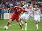 Germany's Emre Can (R) vies for a ball with Denmark's Nicolaj Thomsen during the final tournament of the EURO U21 2015, group A, match between Germany and Denmark on June 20, 2015