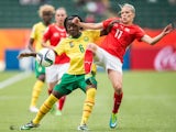 Cameroon's Francine Zouga (L) and Switzerland's Lara Dickenmann collide during their FIFA Women's World Cup group C match at Commonwealth Stadium in Edmonton, Canada on June 16, 2015