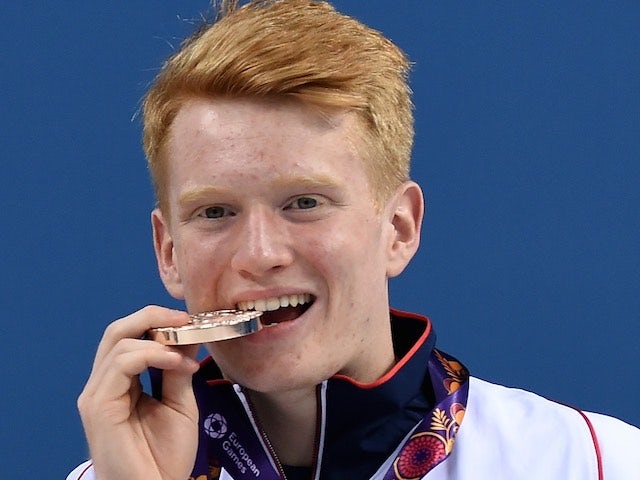 James Heatly poses with his medal after winning diving gold for Team GB at the European Games on June 18, 2015