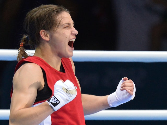 Katie Taylor of Ireland celebrates defeating Sofya Ochigava of Russia to win gold during the women's boxing Lightweight final of the 2012 London Olympic Games at the ExCel Arena August 9, 2012