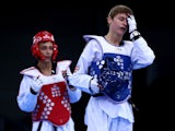 Max Cater of Great Britain turns away in disappointment after losing to Belgium's Si Mohamed Ketbi in the quarter-final of the men's -58kg taekwondo tournament at the European Games in Baku
